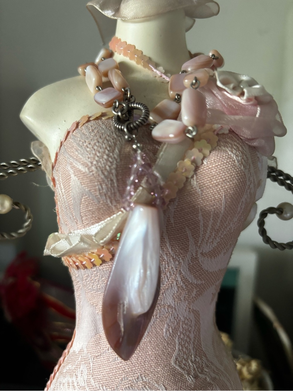Handmade pink mother-of-pearl shell bead necklace featuring rectangular polished